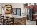 Island kitchen with granite countertops and stainless steel appliances at 14101 Andrew Scott Rd, Spring Hill, FL 34609