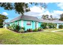 Charming teal home with a nicely landscaped yard at 4209 Prince Pl # A, New Port Richey, FL 34652