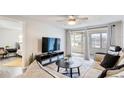 Bright living room with comfy seating and a view of the patio at 4209 Prince Pl # A, New Port Richey, FL 34652