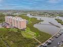 Condo building on the waterfront with a boardwalk and boat slips at 4516 Seagull Dr # 413, New Port Richey, FL 34652