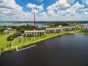 Aerial view of waterfront condo building with private dock at 4550 Bay Blvd # 1237, Port Richey, FL 34668