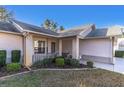 Brick house with a covered porch and well-manicured landscaping at 4635 Bellemede Blvd, New Port Richey, FL 34655