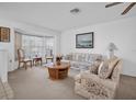 Living room featuring floral sofas and a wood coffee table at 4635 Bellemede Blvd, New Port Richey, FL 34655