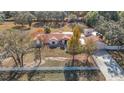 Single-story house with a large backyard and driveway at 5085 Bone Ln, Brooksville, FL 34604