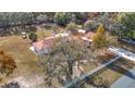 House with a large yard, and a long driveway at 5085 Bone Ln, Brooksville, FL 34604