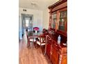 Dining room with a large, ornate wood table and hutch at 5945 21St N St # 2, St Petersburg, FL 33714