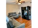 Living room with hardwood floors and gray couches at 5945 21St N St # 2, St Petersburg, FL 33714