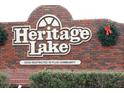 Entrance sign for Heritage Lake, a 55+ deed restricted community at 9327 Whitstone Ct, New Port Richey, FL 34655