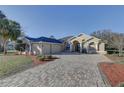 Well maintained single-Gathering home with two car garage and long driveway at 9376 Bearwalk Path, Weeki Wachee, FL 34613