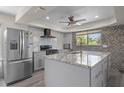 Spacious kitchen with modern appliances and granite countertops at 15806 Adobe Dr, Hudson, FL 34667