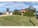 Charming single-story home with a well-manicured lawn and mature landscaping in a quiet neighborhood at 3337 Darlington Rd, Holiday, FL 34691