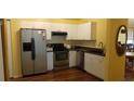 Modern kitchen with stainless steel appliances and white cabinetry at 5031 6Th N Ave, St Petersburg, FL 33710