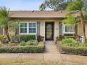 Charming home with manicured landscaping and a welcoming front entrance at 3259 Hilary Cir # 1C, Palm Harbor, FL 34684