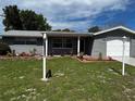 Classic single-story home with attractive landscaping and a welcoming entrance at 7207 Nova Scotia Dr, Port Richey, FL 34668
