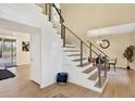 Modern staircase with wooden steps, metal railings, and shiplap accents at 9617 Norchester Cir, Tampa, FL 33647