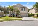 Charming two-story home with a well-manicured lawn and lovely landscaping at 12307 Duckett Ct, Spring Hill, FL 34610