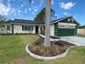 Charming single-story home featuring a landscaped front yard and an attached two-car garage at 4649 Westerly Dr, New Port Richey, FL 34653