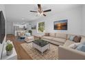 Spacious living room with modern decor, plenty of natural light, and hardwood flooring at 5173 Pacific Ave, Spring Hill, FL 34607