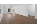 Bright, spacious living room featuring hardwood floors and neutral paint at 5173 Pacific Ave, Spring Hill, FL 34607