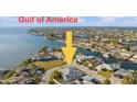 An aerial view of a waterfront community showcasing the beautiful canal and stunning homes at 3912 Rudder Way, New Port Richey, FL 34652
