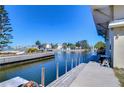 Picturesque waterfront canal view with a private dock, perfect for boating enthusiasts at 6801 Nowiki Ave, Hudson, FL 34667