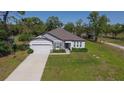 Charming single-Gathering home with a well-manicured lawn and two car garage in a tranquil neighborhood at 11134 Horned Owl Rd, Weeki Wachee, FL 34614