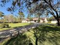 Beautiful single-story home on large lot with mature trees and landscaping at 7090 Red Oak Loop, New Port Richey, FL 34654