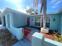 Charming single-story home with a red front door and manicured landscaping at 1817 Dartmouth Dr, Holiday, FL 34691