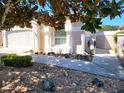 Charming home with beautiful landscaping, featuring rock accents, and a well-manicured walkway at 355 Royal Palm Way, Spring Hill, FL 34608