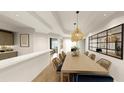 Open dining area featuring a long table with seating, modern lighting, and views into other rooms at 5015 Us Highway 19 # 501, New Port Richey, FL 34652