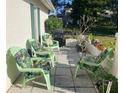 Cozy patio featuring comfortable seating, a grill, and attractive potted plants at 8150 Braddock Cir # 4, Port Richey, FL 34668