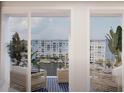 Relaxing balcony space featuring stylish seating and views of the marina and nearby buildings at 5015 Us Highway 19 # 301, New Port Richey, FL 34652