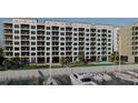 Waterfront condo building with boat slips offering a resort lifestyle with modern amenities at 5015 Us Highway 19 # 404, New Port Richey, FL 34652