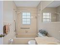 Cozy bathroom featuring a shower-tub combination and neutral tile at 6028 Wilds Dr # 6A, New Port Richey, FL 34653