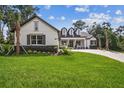 Charming home with manicured lawn and elegant brick driveway on a sunny day at 6452 Summit View Dr, Brooksville, FL 34601