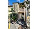 Two-story condo building featuring a stone facade and well-maintained landscaping at 7109 Kirsch Ct # 2, New Port Richey, FL 34653