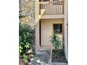 Exterior view of unit number 2 with beige walls and natural stone accents at 7109 Kirsch Ct # 2, New Port Richey, FL 34653