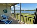 Enclosed patio seating area with views of the water and boat traffic on a sunny day at 8150 Brent St # 713, Port Richey, FL 34668