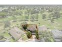 Aerial view of the home highlighting proximity to the golf course with a red line indicating property boundary at 8788 Fetterbush Ct, Brooksville, FL 34613