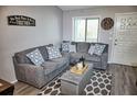 Relaxing living room showcases a gray sectional sofa and modern decor at 1955 Abrico Dr # G12, Lutz, FL 33558