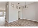 Spacious living area with high ceilings, modern lighting, and an open floor plan at 5357 Greystone Dr, Spring Hill, FL 34609
