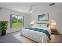 Serene bedroom with large window, neutral decor, and ample natural light at 7292 Sherman Hills Blvd, Brooksville, FL 34602