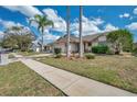 Desirable home in a great neighborhood, with a well-kept lawn and sidewalk at 13032 Pinnacle Ln, Hudson, FL 34669