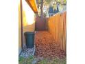 Wooden fence borders the backyard, providing privacy at 5800 Massachusetts Ave, New Port Richey, FL 34652