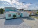 Two-story waterfront home featuring a well-kept yard and a two car garage at 6228 Lonnie Lee Ln, Hudson, FL 34667