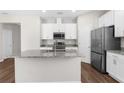 Beautiful kitchen with stainless steel appliances and granite countertops at 8338 Maybelle Dr, Weeki Wachee, FL 34613