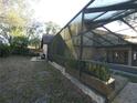 A partial view of the expansive screened-in pool area at 8526 Delaware Dr, Weeki Wachee, FL 34607