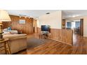 Comfortable living room with wood paneling and lots of natural light at 10736 Queens Rd, Port Richey, FL 34668