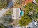 Aerial view of home with pool, showcasing the layout and backyard oasis in a desirable neighborhood at 12511 Stone House Loop, Hudson, FL 34667