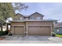 Two story home featuring an attached two car garage and neutral color scheme at 13304 Mandalay Pl, Spring Hill, FL 34609